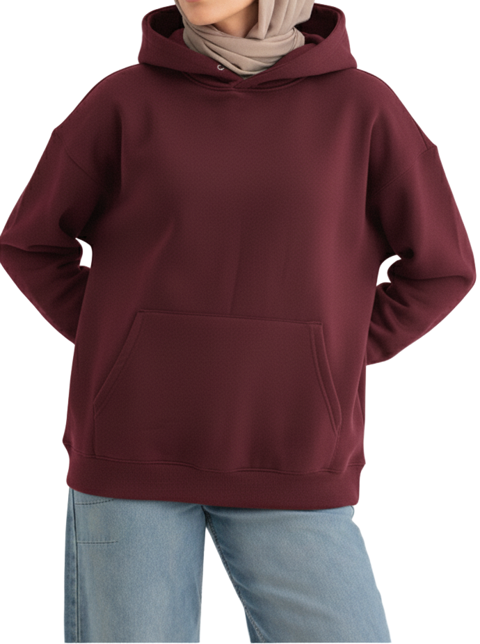 Person wearing a maroon hoodie and light blue jeans on a white background