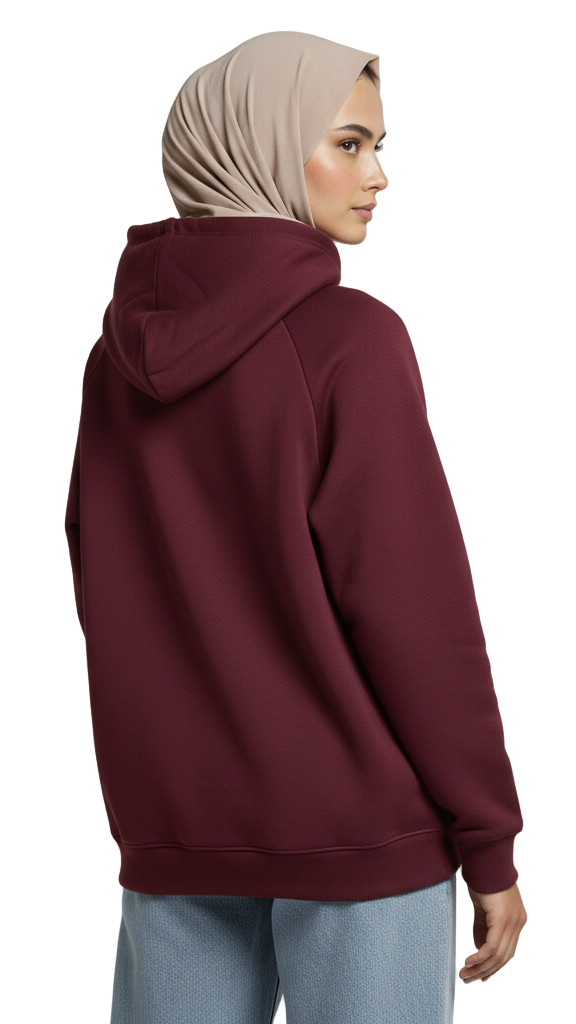 Person wearing a maroon hoodie and light blue jeans on a plain background